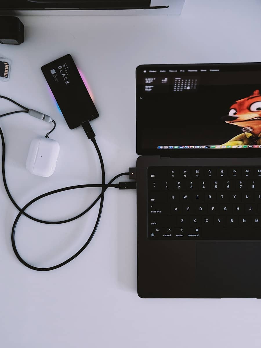 A laptop computer sitting on top of a white table